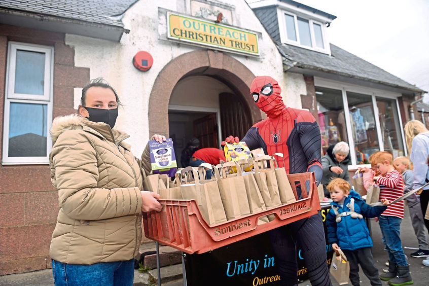 Pictured is organiser Donella McHattie with spiderman at the Easter Egg hunt organised by the Light House Youth Club in Turriff.