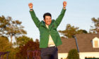 Masters champion Hideki Matsuyama of Japan celebrates wearing the Green Jacket.