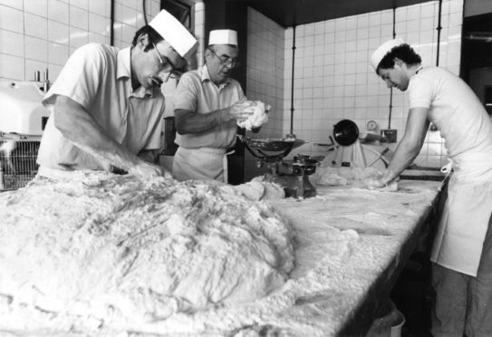 Adam Duguid, nightshift doughman, prepares the bread mixture while David Mair and Brian McIntosh prepare the rowie mixture at Chalmers' Bakery in Bucksburn in 1992.