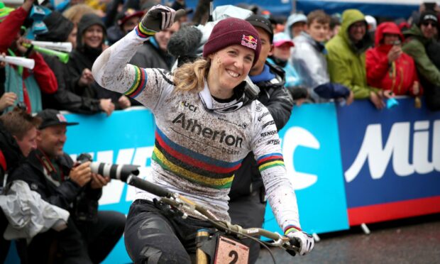 Great Britain's Rachel Atherton celebrates winning the Women's Downhill during the UCI Mountain Bike World Cup at Fort William in 2019.