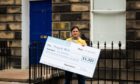 To go with story by Calum Ross. Election story Picture shows; Edinburgh Northern and Leith candidate Rebecca Bell delivering the cheque . Edinburgh. Supplied by Scottish Liberal Democrats Date; 28/04/2021