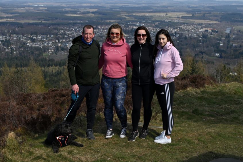 Peterhead family (left) Andrew Innes, Imogen Reid, Sarah Innes, Cara Reid at the top of Scolty Hill, Banchory.