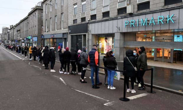 Eager shoppers queue outside Primark on Union Street ahead of its opening this morning. Picture by Kenny Elrick