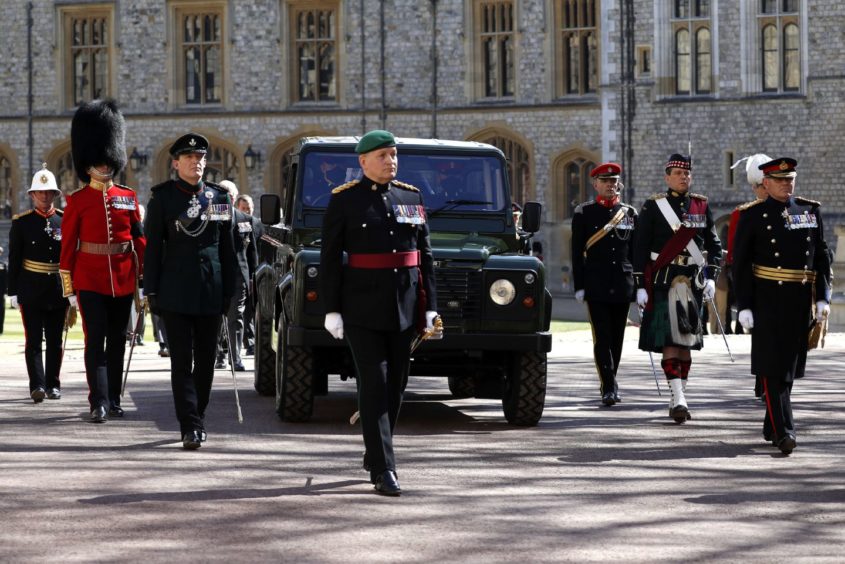 The Land Rover Defender carrying the coffin of the Duke of Edinburgh during the funeral of the Duke of Edinburgh at Windsor Castle, Berkshire. Picture date: Saturday April 17, 2021. PA Photo. See PA story FUNERAL Philip. Photo credit should read: Alastair Grant/PA Wire