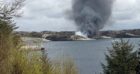 Smoke rising from the crash site of the CHC Super Puma HC225