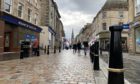 Shoppers casually worked their way along Inverness High Street