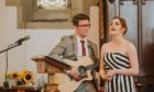 Katie and her husband James performing at a wedding together