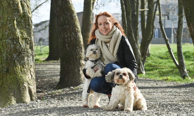 Stacey Toner, director of Moray Arts Development Engagement, with Shih Tzus Meryl and Maggie.