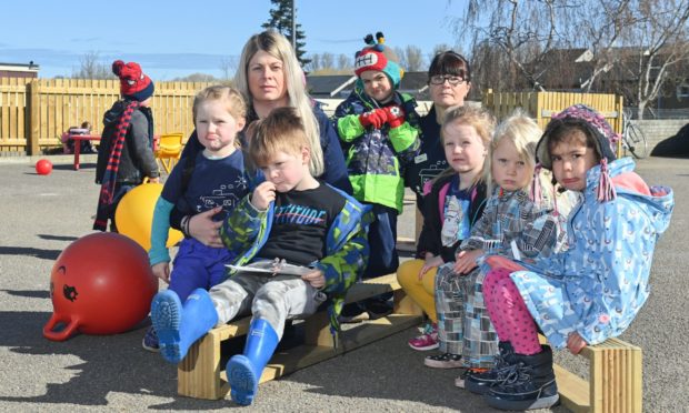 Managing Director Lauren Hayward and early years practitioner Karen Park with children from Jack and Jill Nursery.