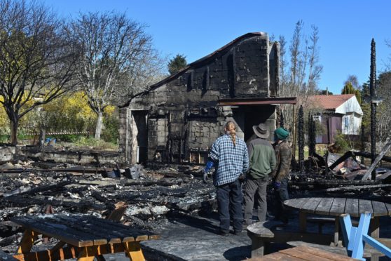 Residents at the Findhorn Foundation community have stopped to look at the remains following the fire.