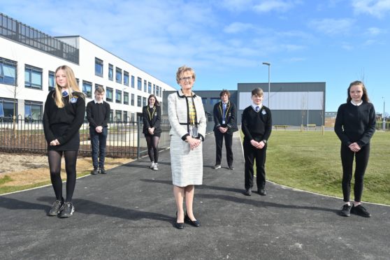 Head Teacher Janice Simpson is pictured with pupils from S2 through to S6 at the New Lossiemouth High School.