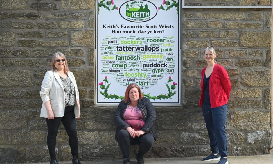 Keith's love of Doric as Scotland's only Scots toun has been celebrated with the town centre display. Pictured: Strathisla Regeneration Project chairwoman Rhona Patterson and directors Adele Williams and Linda Riggall.