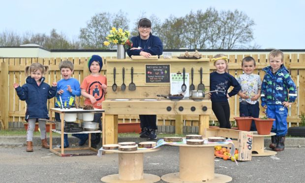 Children at the Jack and Jill Nursery in Elgin enjoy the new mud kitchen donated by Moray Mud Kitchen.