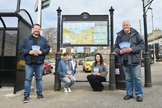 Cullen Voluntary Tourist Initiative chairman David McCubbin, Clare Lock owner of Clock Studio, Maggi Dawson from Intricate Designs, Cullen Voluntary Tourist Initiative Secretary and Treasurer Graham Bell near the new map.