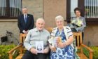 Willie and Helen Simpson celebrating their Diamond Wedding Anniversary with Deputy Lieutenant Joan Cowe and councillor John Cowe who presented the couple with cards and flowers.