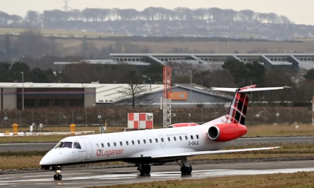 A Loganair plane at Aberdeen International Airport.. The airline is offering passengers free changes to their bookings so they can watch Prince Philip's funeral on Saturday