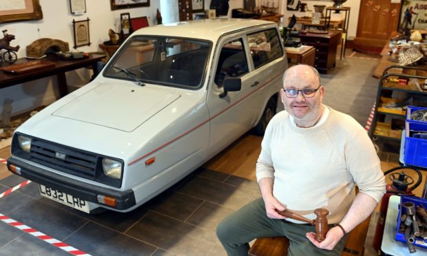 Clive Hampshire of charity Smile Scotland at its auction house in Oyne.