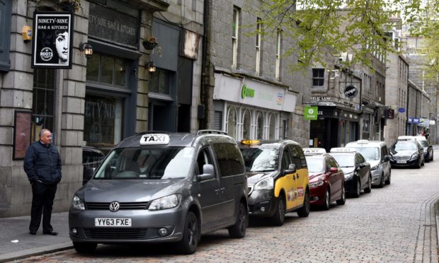 Taxis line up at the Back Wynd rank, Aberdeen, which has since been moved to make way for physical distancing measures in the city centre