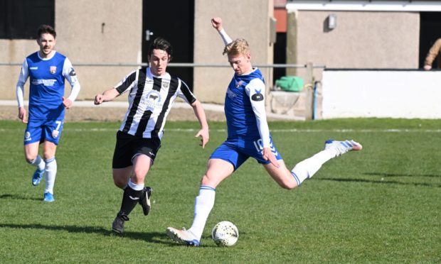 Grant Campbell, of  Fraserburgh, defends against Montrose's Russell McLean. Picture by Paul Glendell