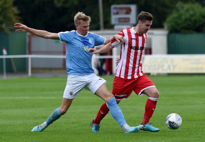 Nairn's Adam Porritt and Formartine United's Graeme Rodger. 