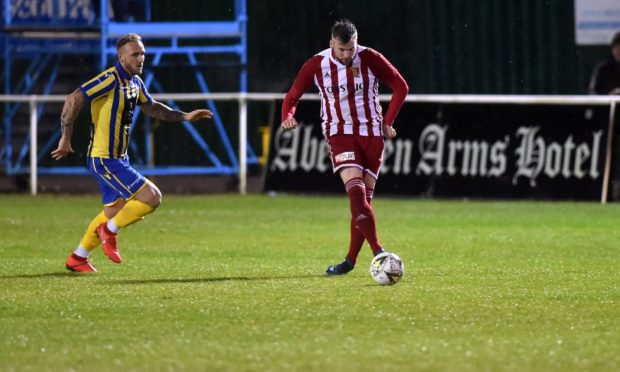 Craig McKeown, right, in action for Formartine