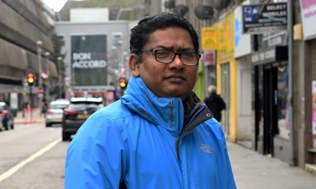 Ahashan Habib, manager of Aberdeen Multicultural Centre, in George Street - where traders were recently shaken by the news John Lewis would close