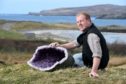 Neil MacDonald, chairman of Scourie Community Development Company with one of the exhibits which will eventually go on display at Scourie Rocks