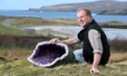Neil MacDonald, chairman of Scourie Community Development Company with one of the exhibits which will eventually go on display at Scourie Rocks