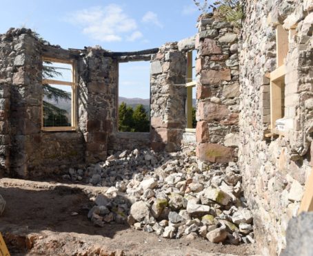 Picture by SANDY McCOOK   13th April '20
Keith and Kyra Readdy begin the task of rebuilding the fire damaged Boleskine House on the shores of Loch Ness which was severely damaged by two seperate fires in recent years.