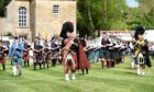 Pipers perform at the Gordon Castle Highland Games in 2018.