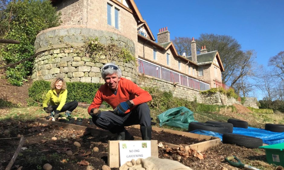 Camphill Wellbeing Trust chief exectuive AIleen Primrose and Dr Stefan Geider get their hands dirty at the former Aberdeen Waldorf School