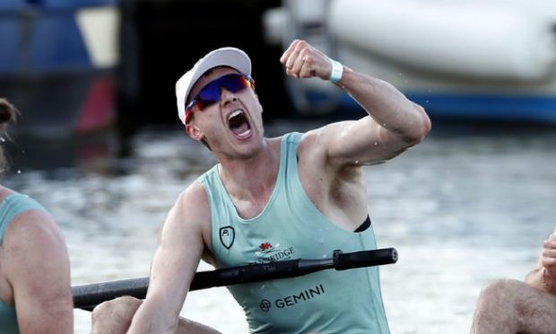 Ben Dyer celebrates after winning the Boat Race with Cambridge.