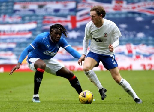 Cove Rangers' midfielder Broque Watson up against Calvin Bassey of Rangers.