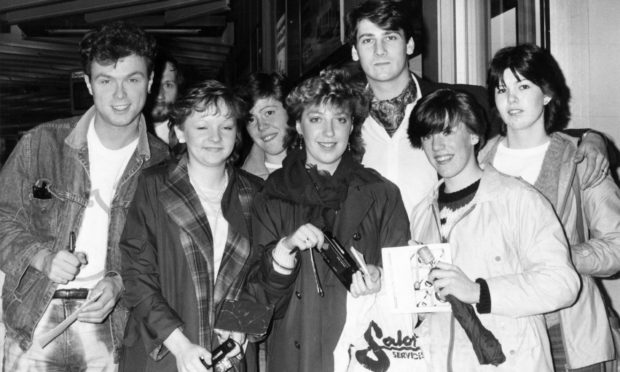 Spandau Ballet's Tony Hadley and Gary Kemp (left) sign autographs at Aberdeen Airport in 1983 before their performance at His Majesty's Theatre.