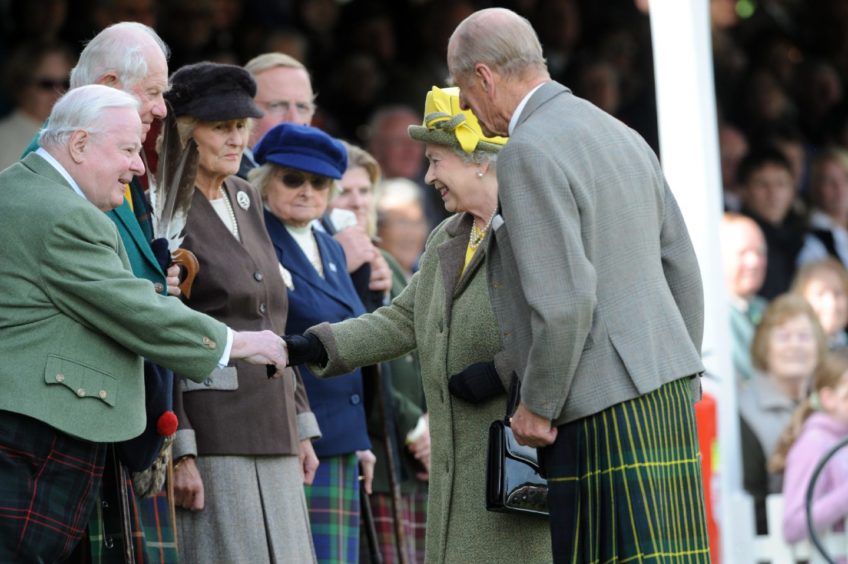 The Queen and Prince Philip speaking their guests at the Braemar Gathering. Pic by Raymond Besant. 05/09/09