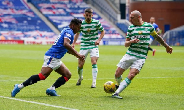 Alfredo Morelos of Rangers tries to get past Scott Brown of Celtic during Sunday's Glasgow derby.