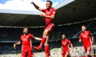 Aberdeen's Andrew Considine celebrates scoring the winner at Celtic in May 2018.