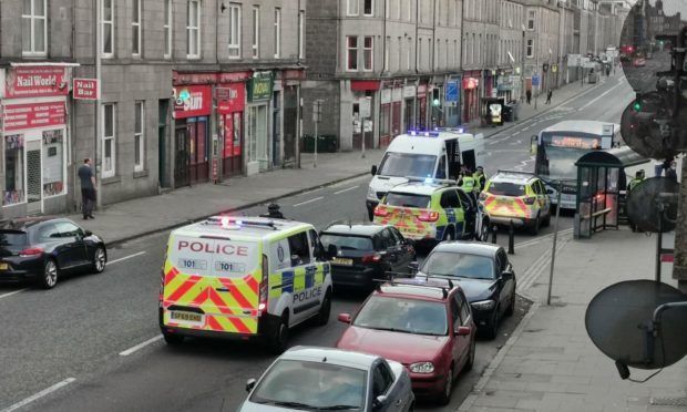 Four police vehicles attended the scene on King Street in Aberdeen.