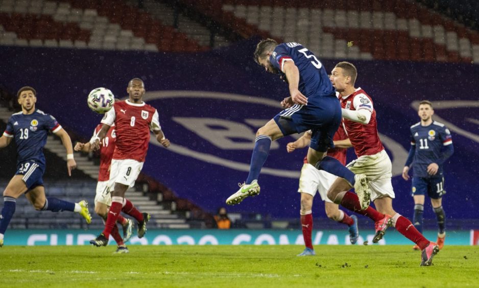 Grant Hanley scores for Scotland against Austria.