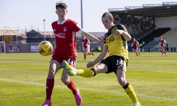 Aberdeen's Calvin Ramsay's first start for Aberdeen, against Dumbarton in the Scottish Cup under an interim management team.