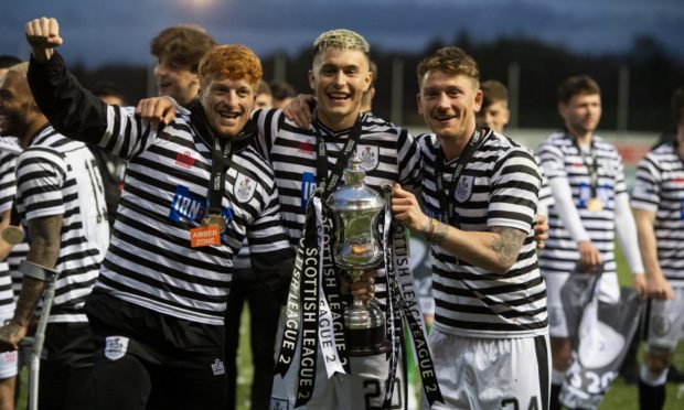 Queen's Park's Simon Murray, Willam Baynham and Michael Doyle celebrate winning the SPFL League Two title.