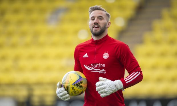 Aberdeen's Gary Woods warms up ahead of a Scottish Premiership match against Livingston.