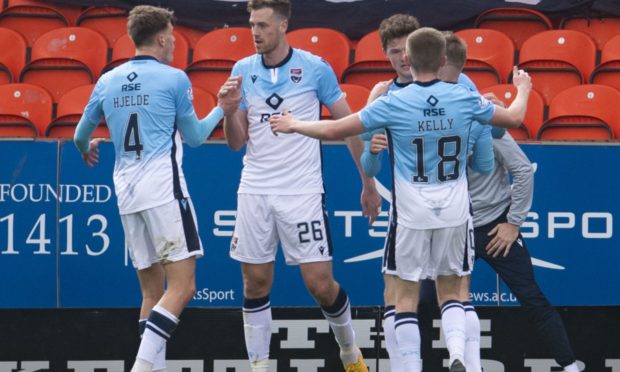 Ross County's Jordan White (centre) celebrates his opener against Dundee United.