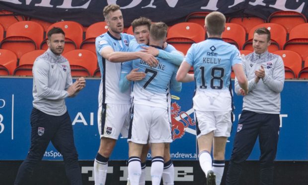 Jordan White (left) celebrates his opener during a Scottish Premiership match between Dundee United and Ross County.