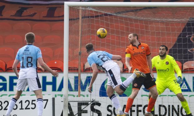 Ross County's Jordan White scores the opening goal against Dundee United.