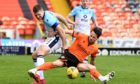 Ross County's Iain Vigurs (left) challenges Dundee United forward Marc McNulty in Saturday's 2-0 win for the Highlanders. Picture by Craig Foy/SNS Group