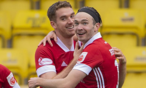 Ryan Hedges celebrates his goal with Tommie Hoban on his return at Livingston