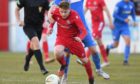 Andy Macrae in action for Brora Rangers.