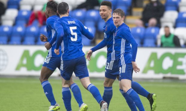 Cove players celebrate Leighton McIntosh's goal.