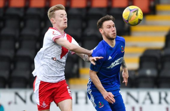 Airdrie's Kyle Turner (L) and Cove's Mitch Megginson.